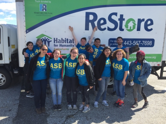 Suffolk University students working on the interior construction of our ReStore building.